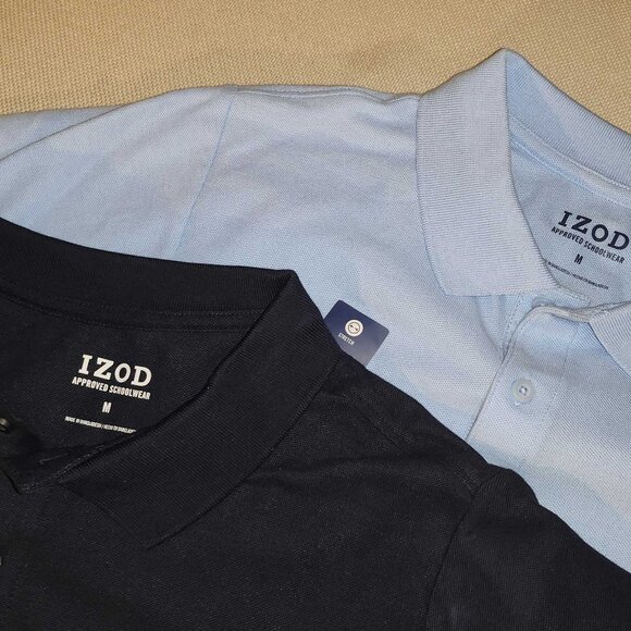 Two (2) Izod POLO SHIRTS * Medium * Navy & Light Blue * NEW Approved Schoolwear - Picture 1 of 2